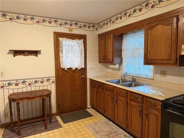 a bathroom with a sink a mirror and shower