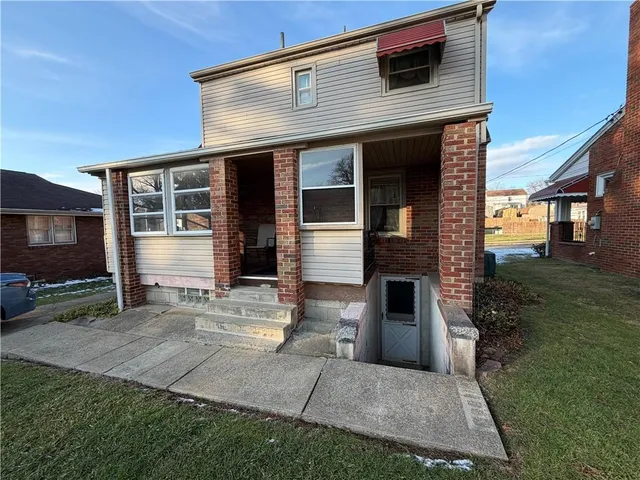 front view of a house with a yard