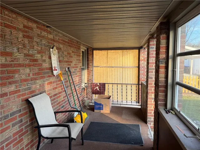 a view of a living room and a wooden floor