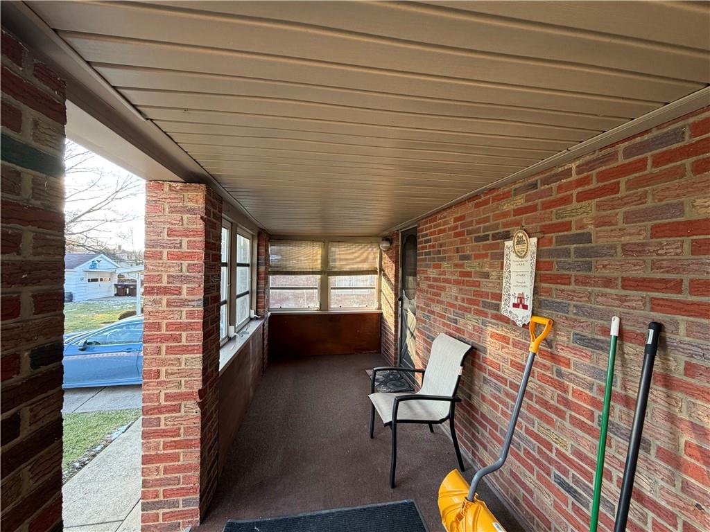 508 Tamplin Street Sharon, PA 16146 - Photo 7 of 29 a balcony with chairs and wooden floor