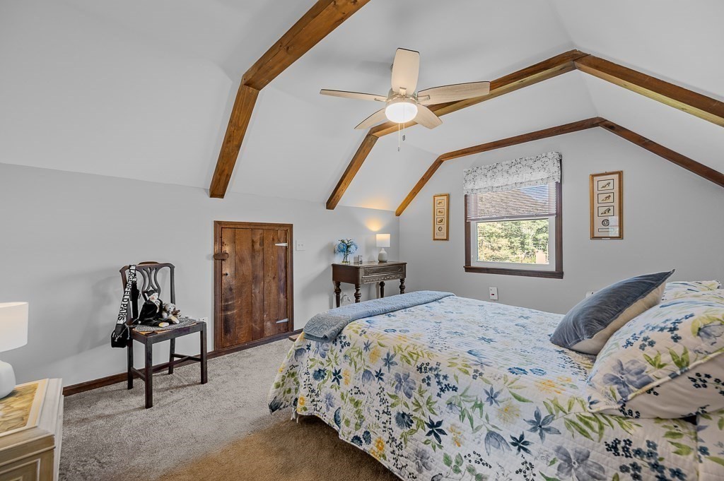 62 Larned Road Oxford, MA 01540 - Photo 16 of 42 a bedroom with a bed and a chandelier