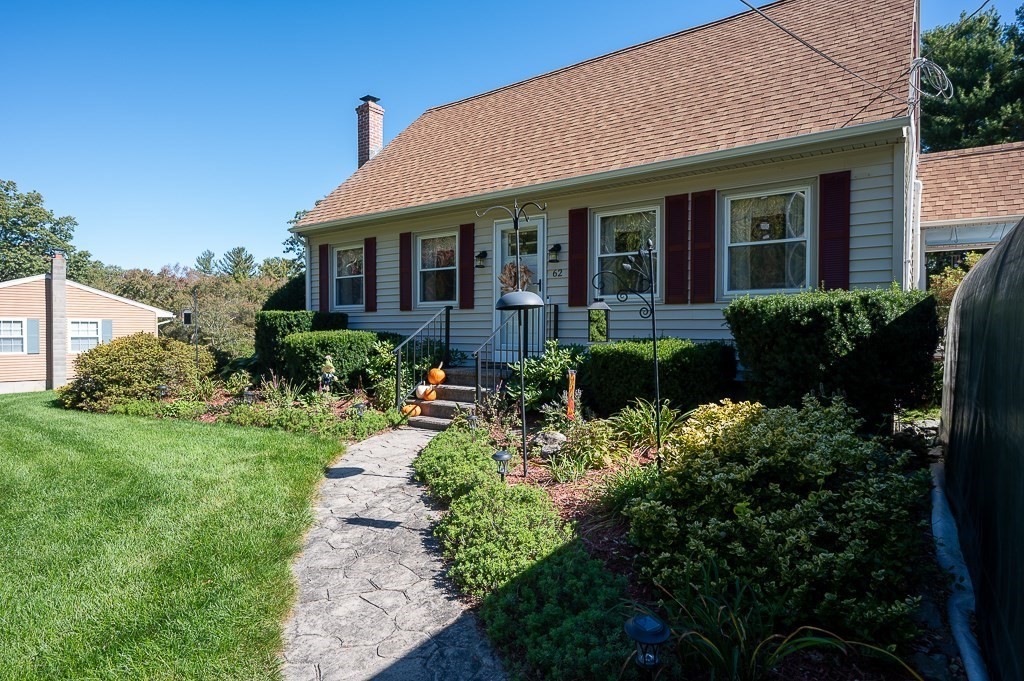 62 Larned Road Oxford, MA 01540 - Photo 2 of 42 a front view of a house with a yard and potted plants