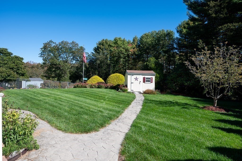 62 Larned Road Oxford, MA 01540 - Photo 29 of 42 a view of a play ground in front of a house with a big yard plants and large tree