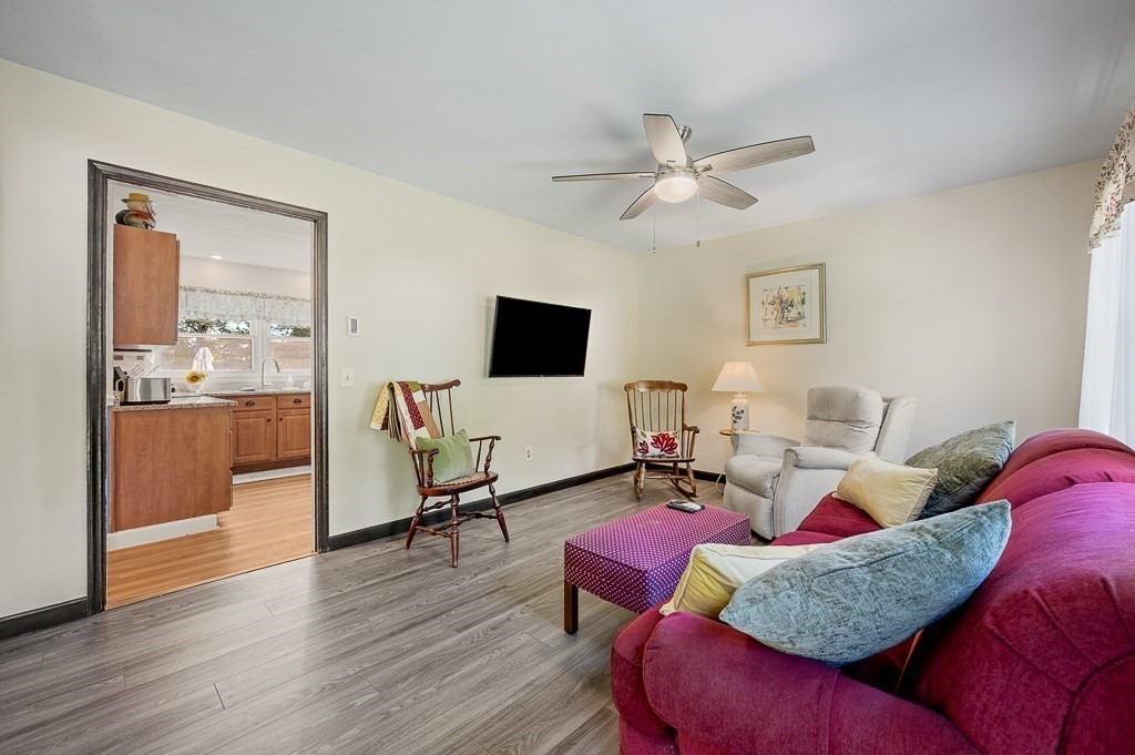 62 Larned Road Oxford, MA 01540 - Photo 6 of 42 a living room with furniture and a flat screen tv