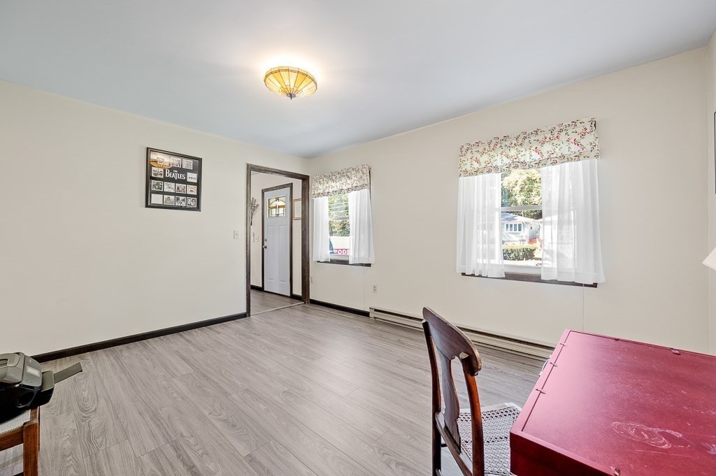 62 Larned Road Oxford, MA 01540 - Photo 7 of 42 a view of a room with wooden floor and windows