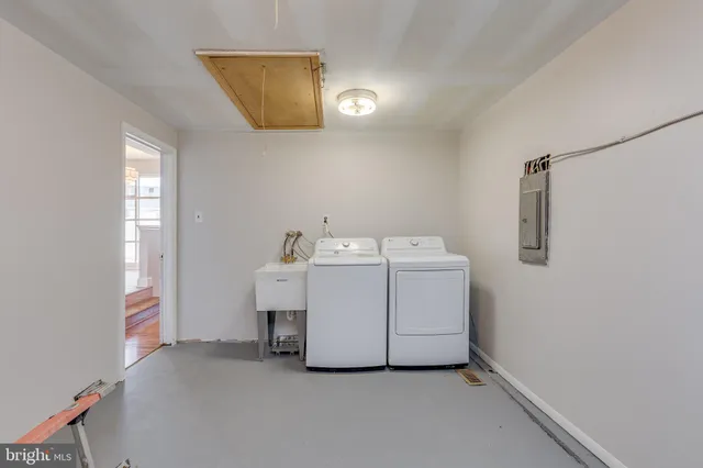 a utility room with dryer and washer