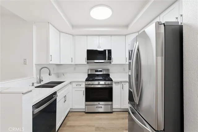 a kitchen with a stove microwave and refrigerator
