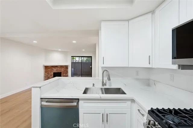 a kitchen with a sink and cabinets