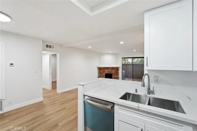 a kitchen with a sink and a refrigerator