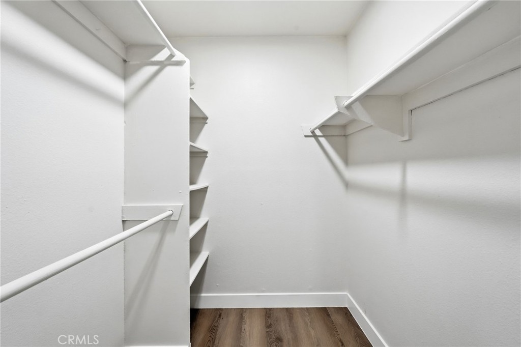 15511 Sherman Way, Unit 19 Van Nuys, CA 91406 - Photo 20 of 31 a view of walk in closet with empty racks
