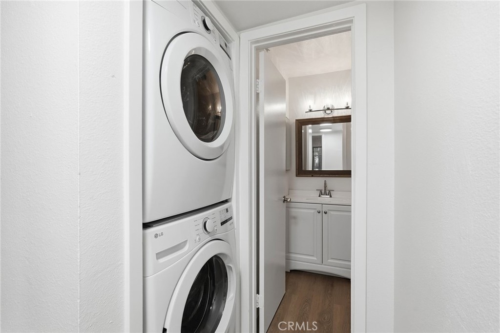 15511 Sherman Way, Unit 19 Van Nuys, CA 91406 - Photo 23 of 31 a view of a storage and utility room with washer and dryer