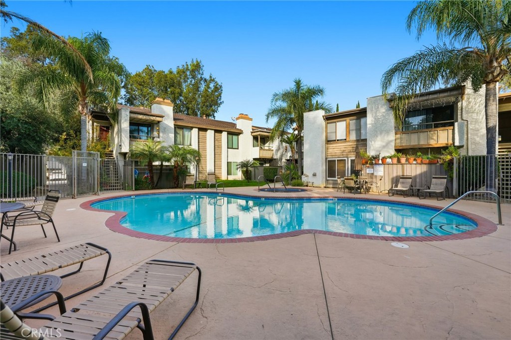 15511 Sherman Way, Unit 19 Van Nuys, CA 91406 - Photo 24 of 31 a view of a house with a swimming pool and sitting area