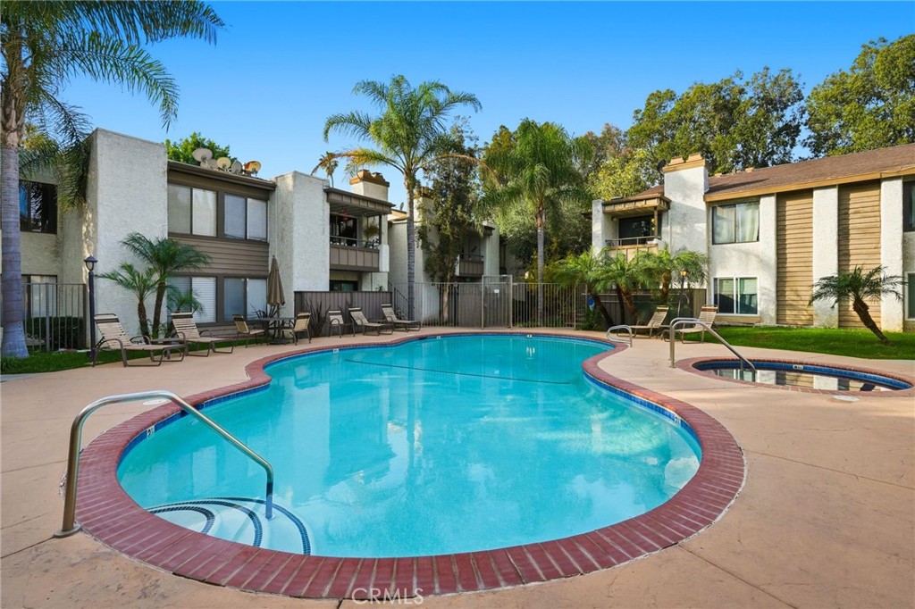 15511 Sherman Way, Unit 19 Van Nuys, CA 91406 - Photo 25 of 31 a view of a house with swimming pool
