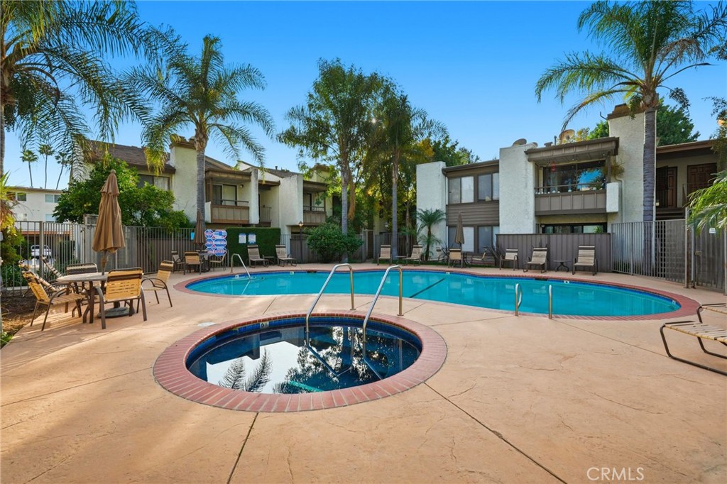 15511 Sherman Way, Unit 19 Van Nuys, CA 91406 - Photo 26 of 31 a view of a swimming pool with a patio