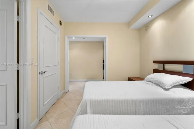 a bedroom with a bed and a table