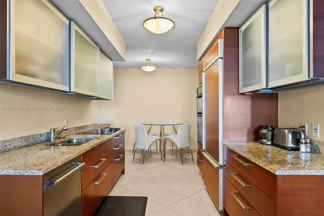 a kitchen with a stove cabinets and a sink