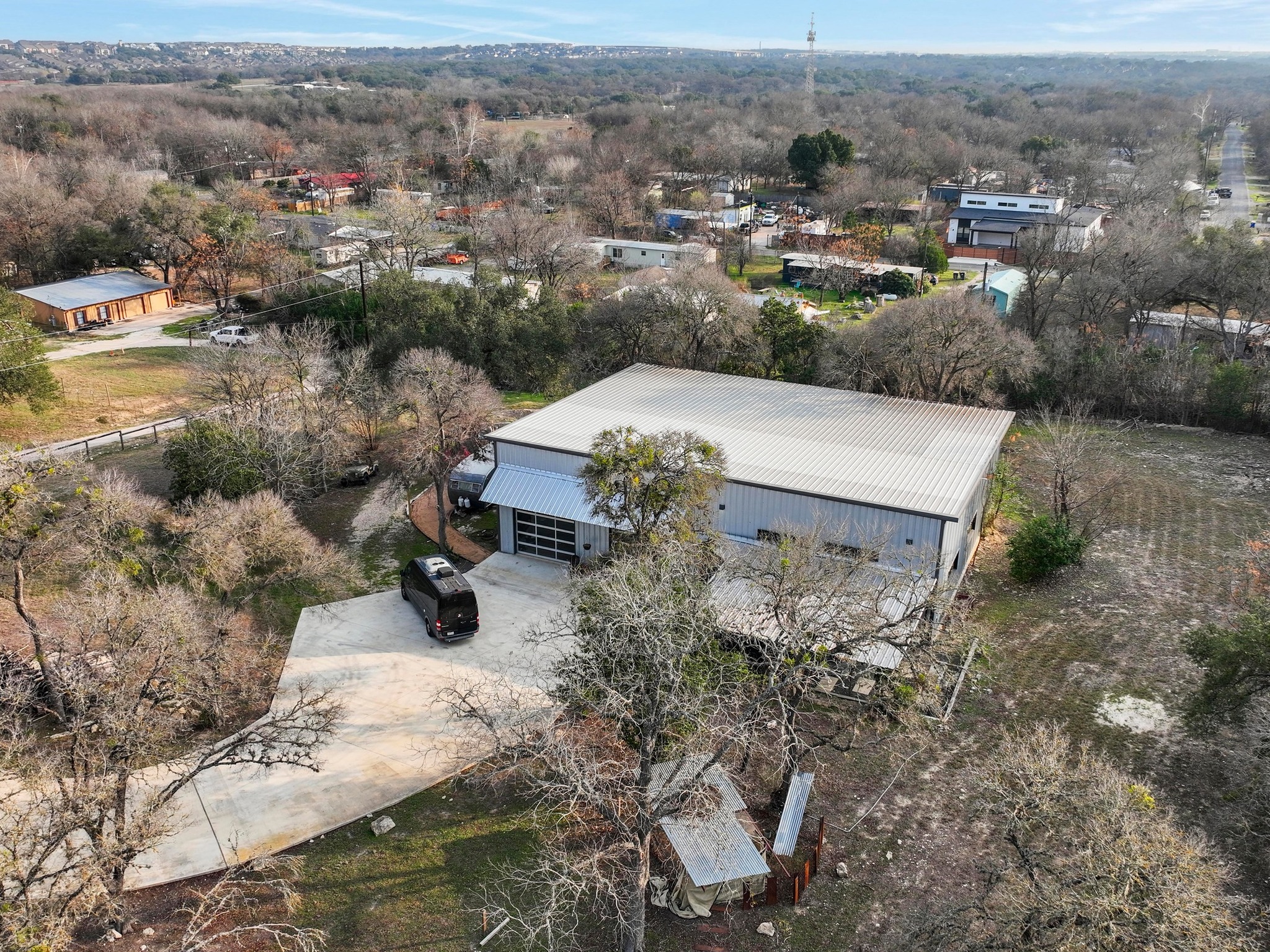 12302 Bethel Church Road Manchaca, TX 78652 - Photo 30 of 35 an aerial view of a house with yard and mountain view in back