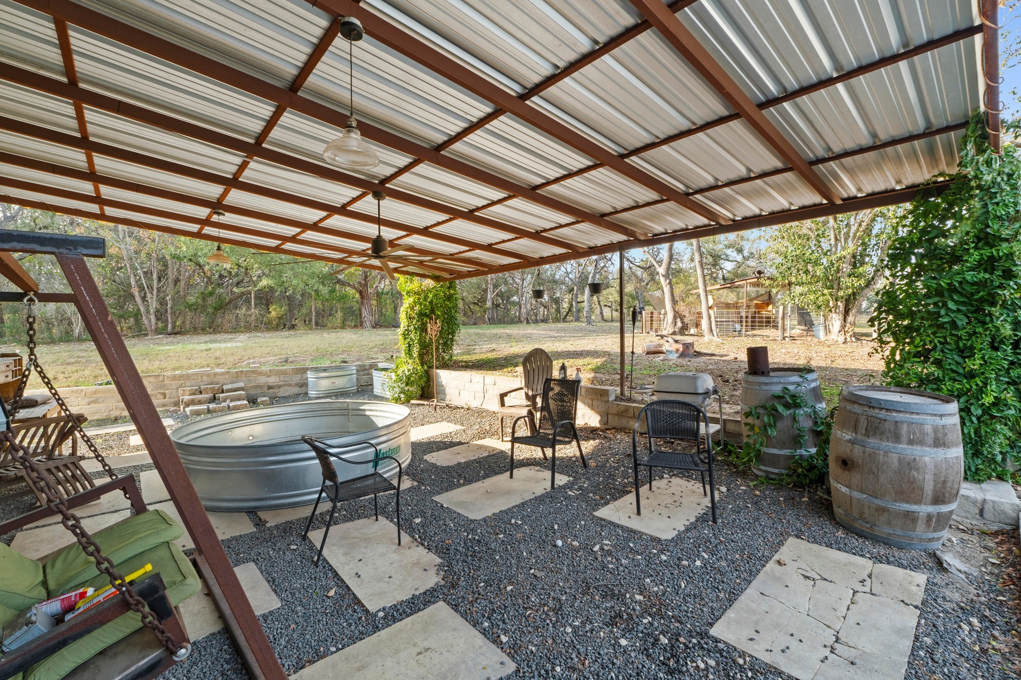 12302 Bethel Church Road Manchaca, TX 78652 - Photo 31 of 35 a view of a patio with table and chairs and potted plants