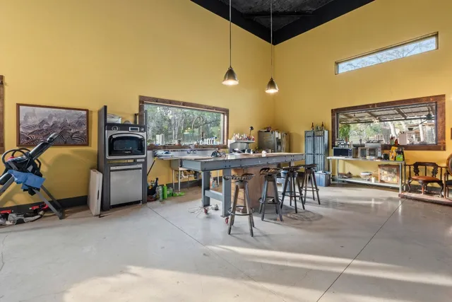 a living room with lots of furniture and a chandelier