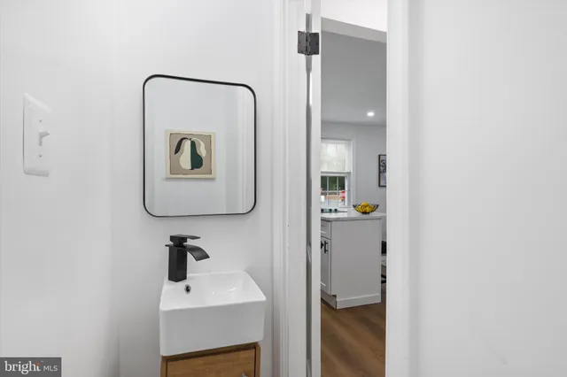 a bathroom with a sink and mirror