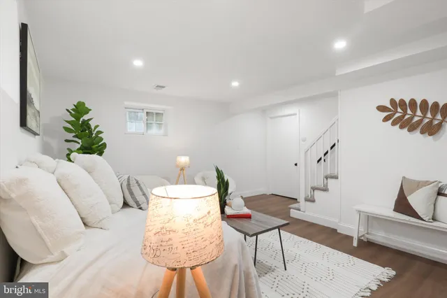 a living room with furniture and a rug