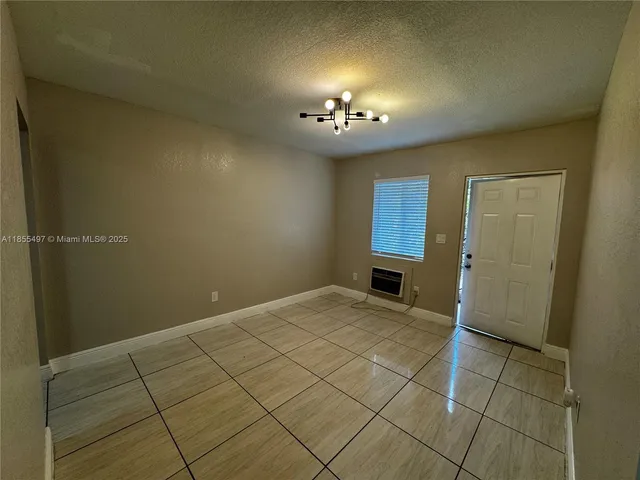 an empty room with a bathroom