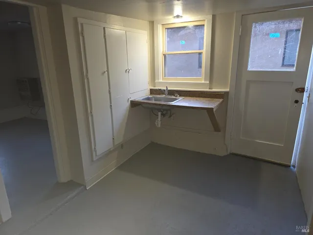 a room with window and cabinet