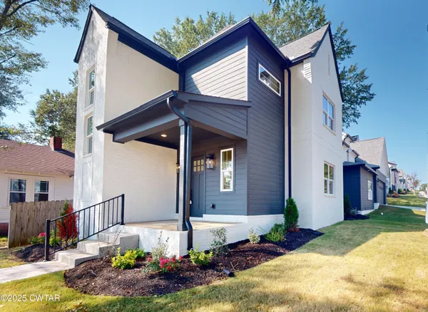 a front view of house with yard