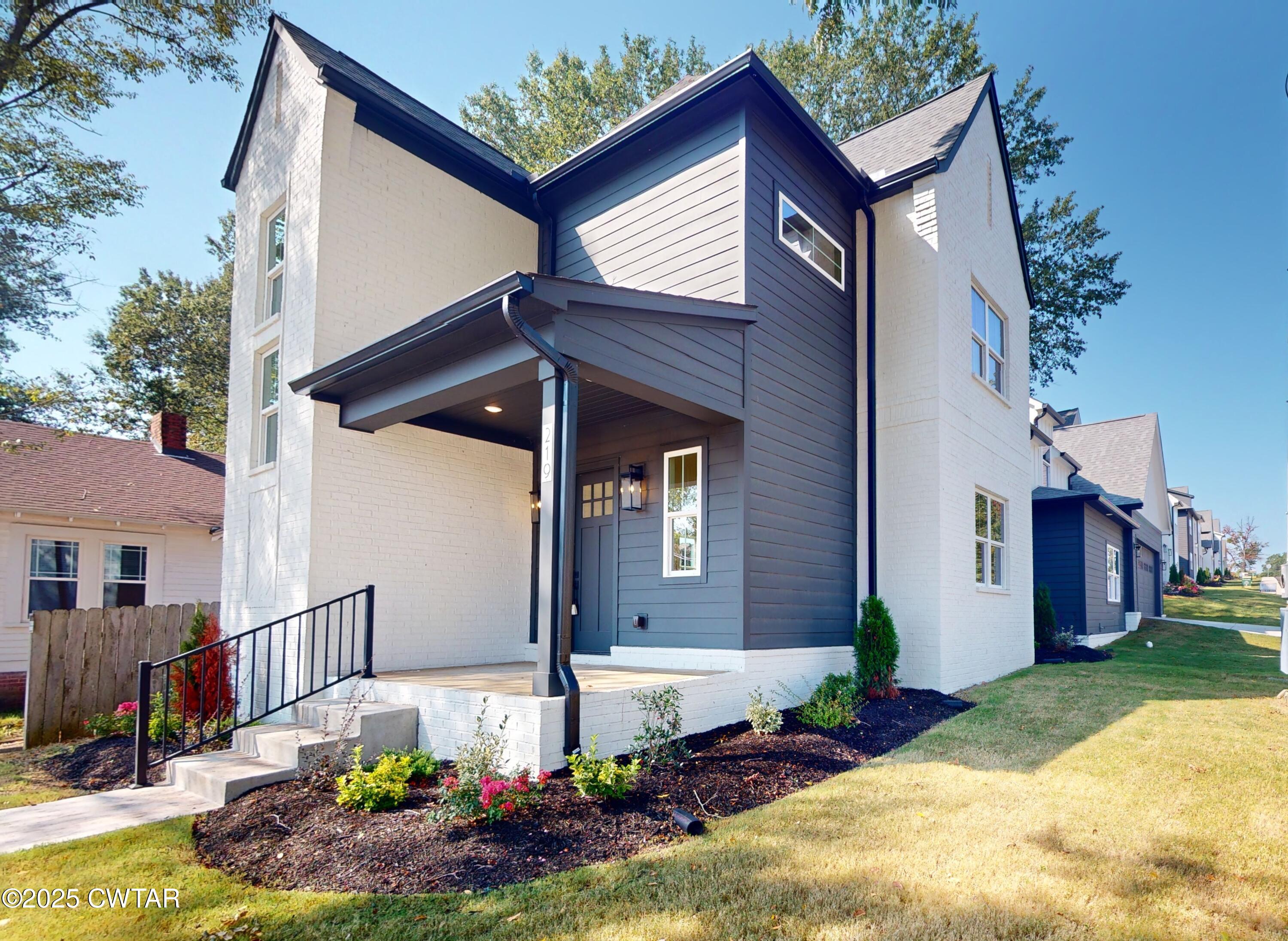 a front view of house with yard
