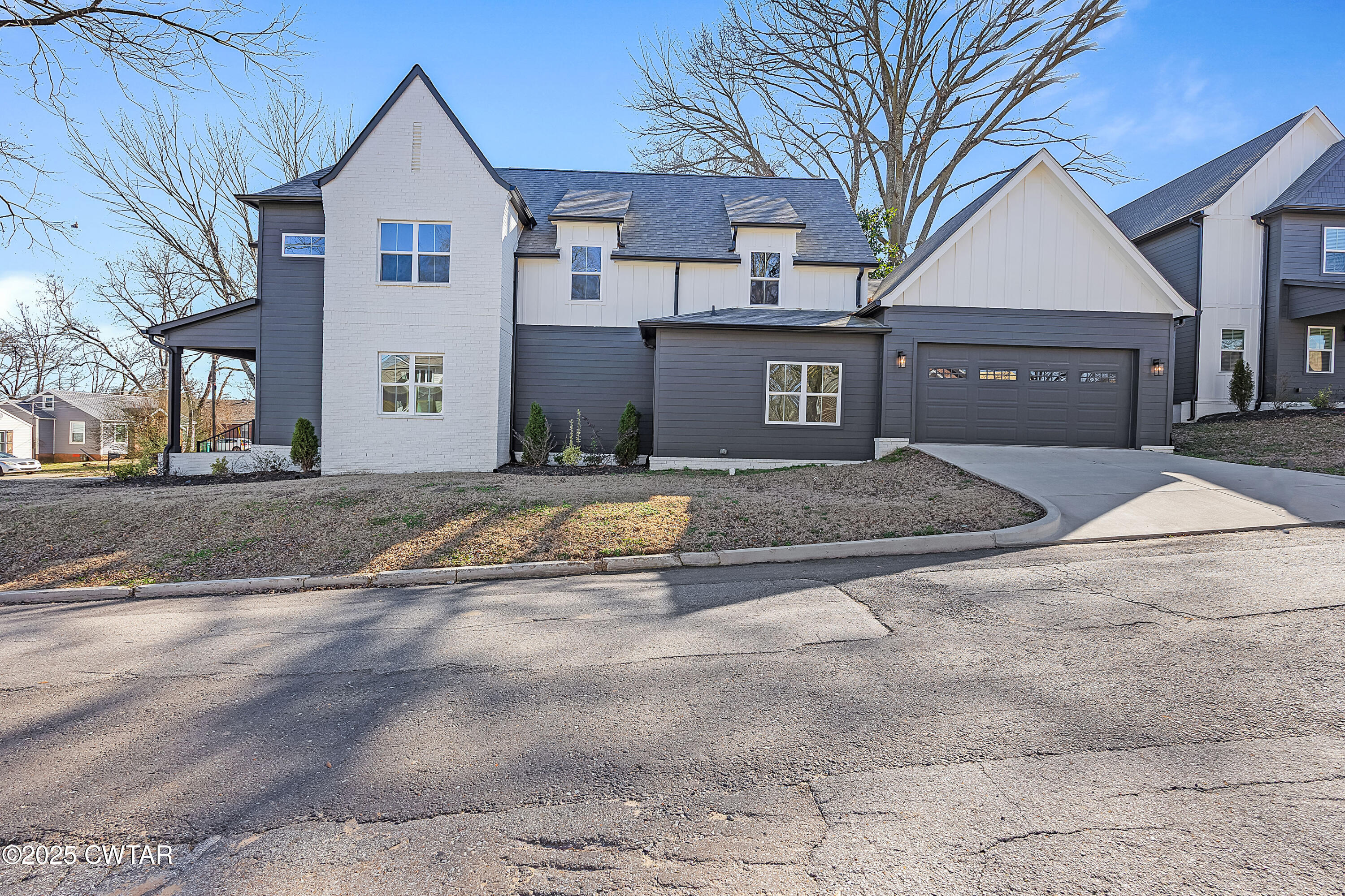 219 Clay Street Jackson, TN 38301 - Photo 2 of 25 a front view of a house with a yard