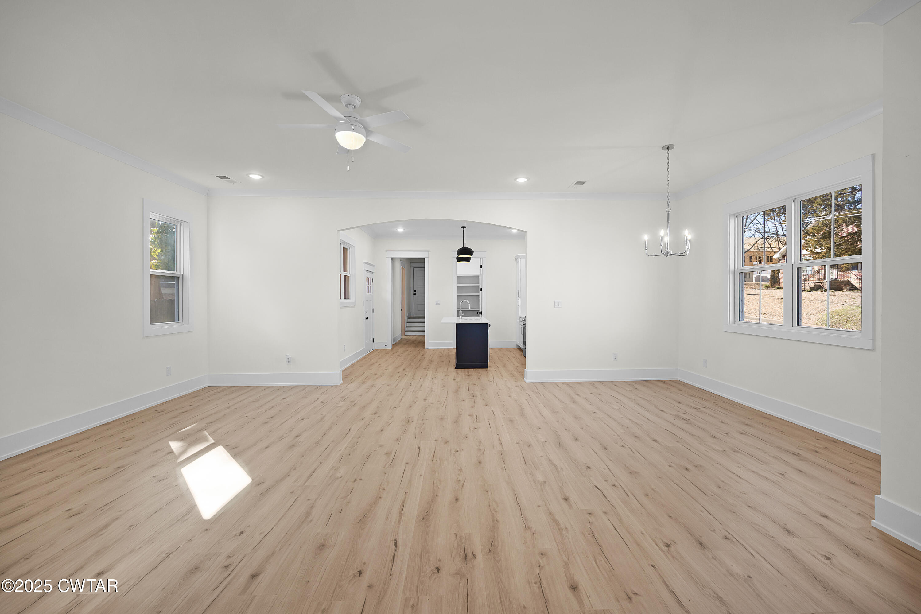 219 Clay Street Jackson, TN 38301 - Photo 22 of 25 a view of empty room with wooden floor and window