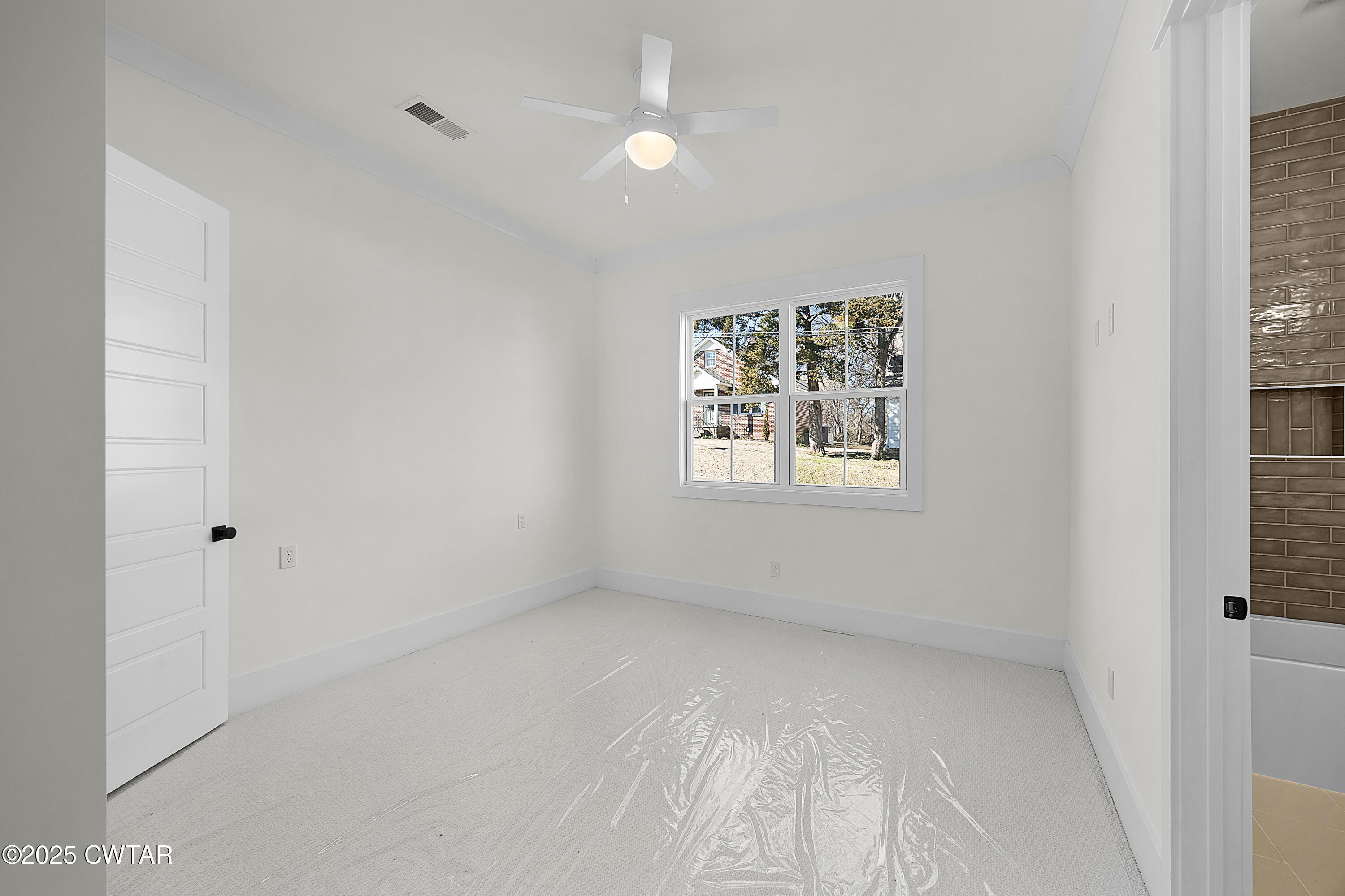 219 Clay Street Jackson, TN 38301 - Photo 9 of 25 a view of room with window and ceiling fan