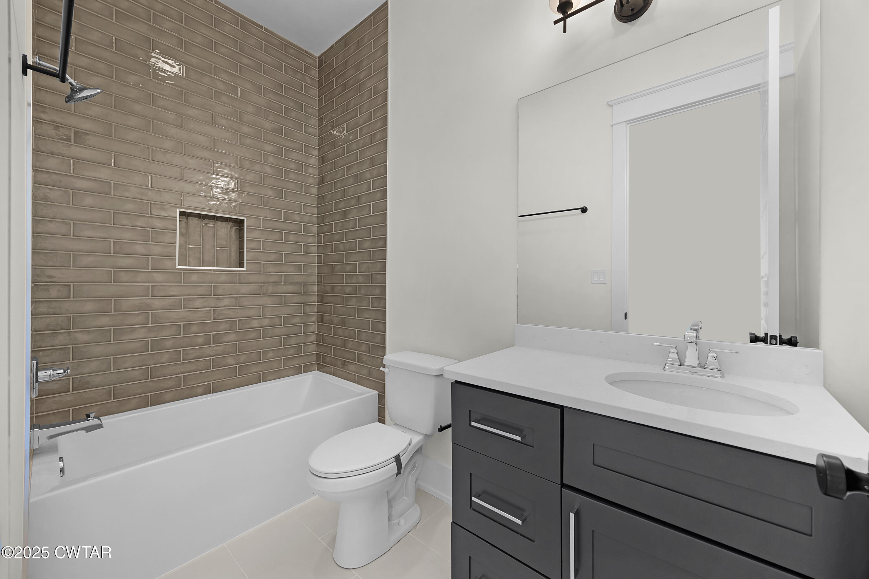 219 Clay Street Jackson, TN 38301 - Photo 10 of 25 a bathroom with a sink a toilet and shower