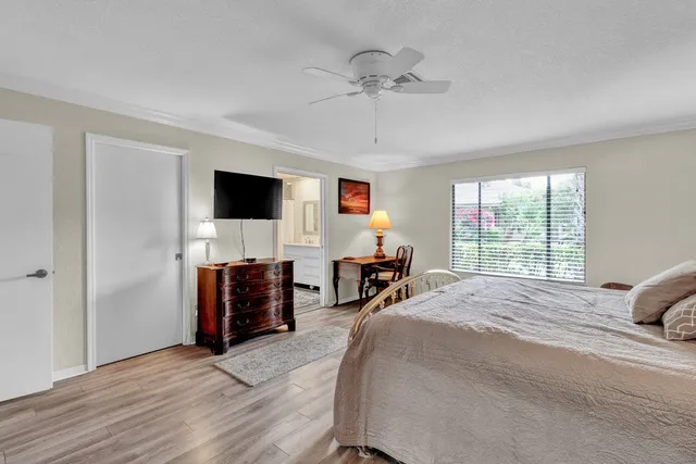 a bed room with a bed and a television