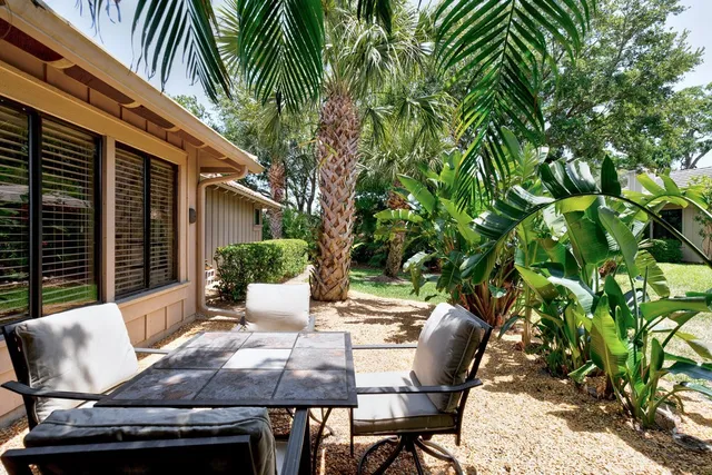 a view of an outdoor sitting area with furniture