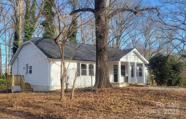 a house with trees in front of it