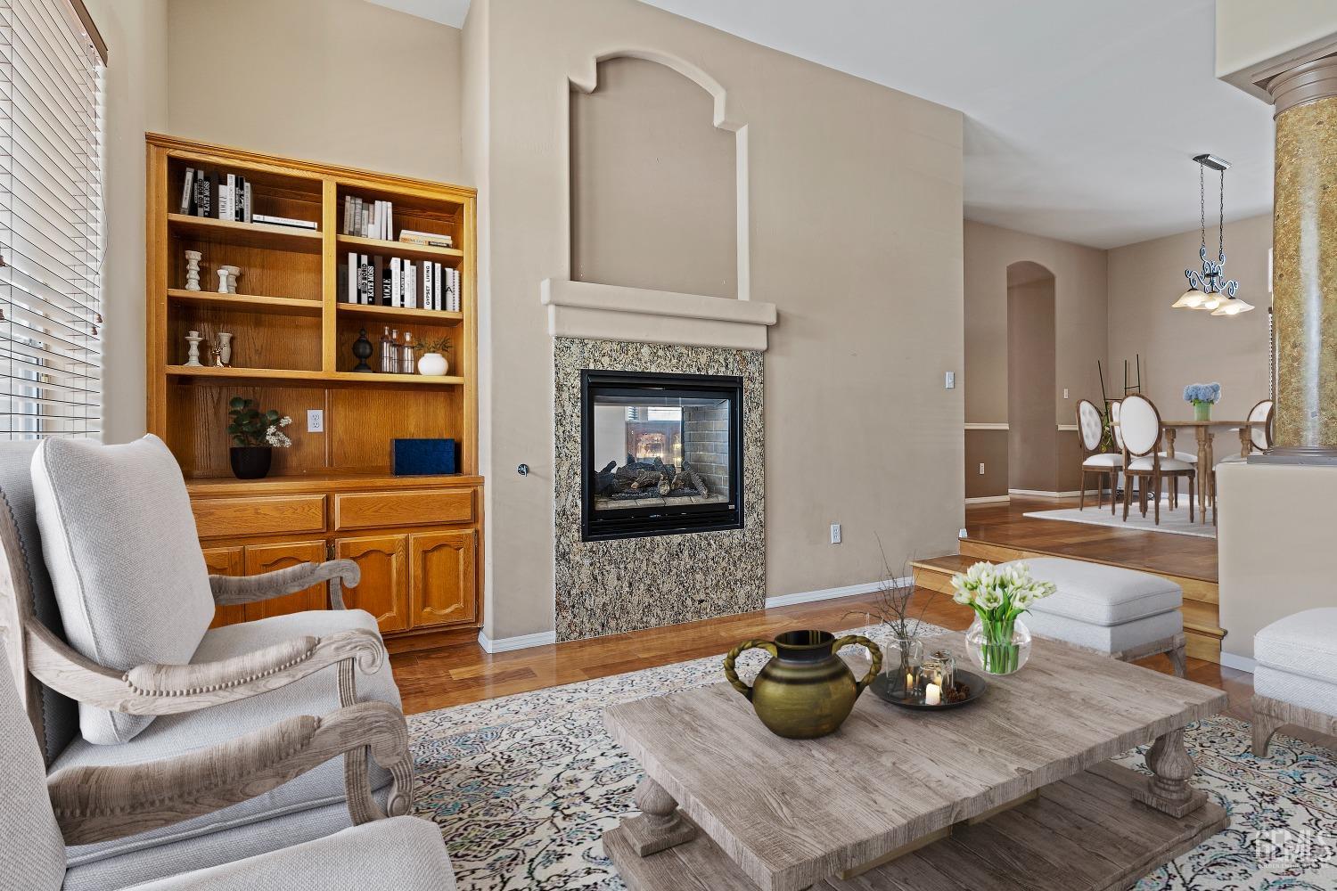 Undisclosed Address Bakersfield, CA 93306 - Photo 12 of 41 a living room with furniture and a potted plant