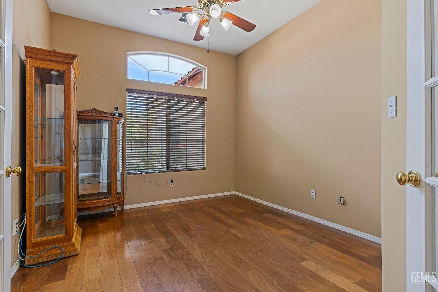 Undisclosed Address Bakersfield, CA 93306 - Photo 14 of 41 wooden floor and window in an empty room