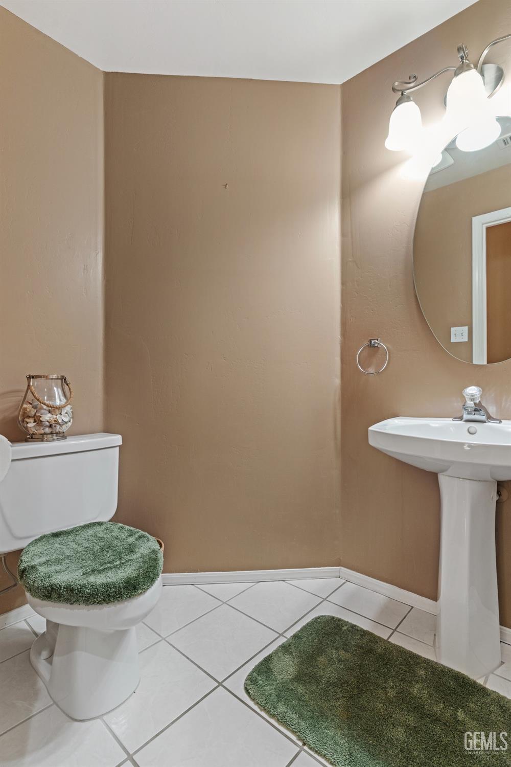 Undisclosed Address Bakersfield, CA 93306 - Photo 15 of 41 a bathroom with a sink and a mirror