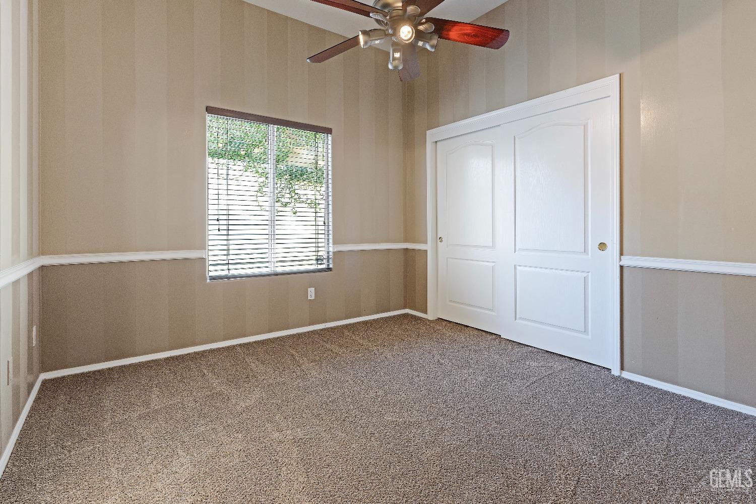 Undisclosed Address Bakersfield, CA 93306 - Photo 21 of 41 an empty room with windows and fan