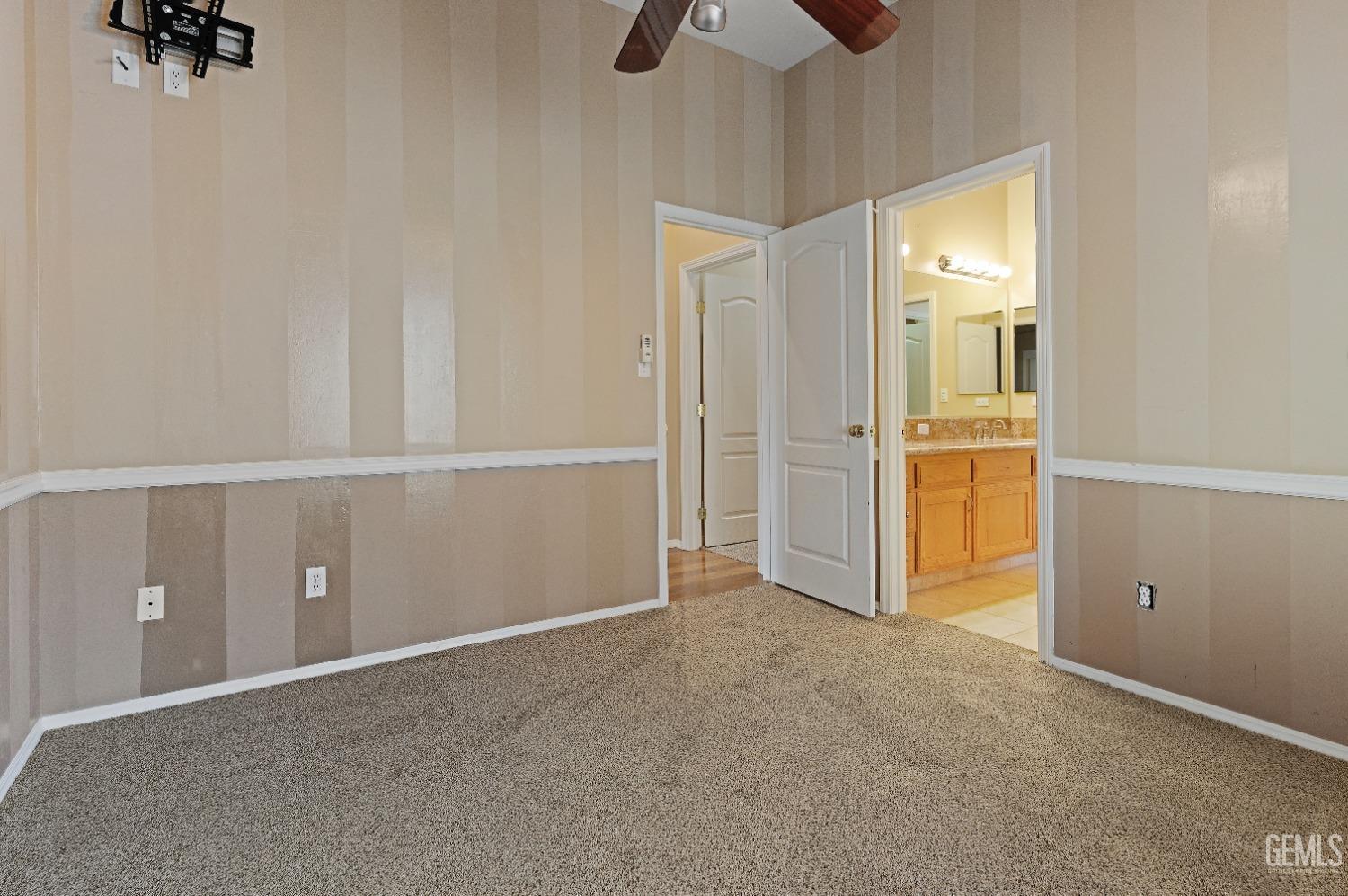 Undisclosed Address Bakersfield, CA 93306 - Photo 22 of 41 an empty room with closet and windows