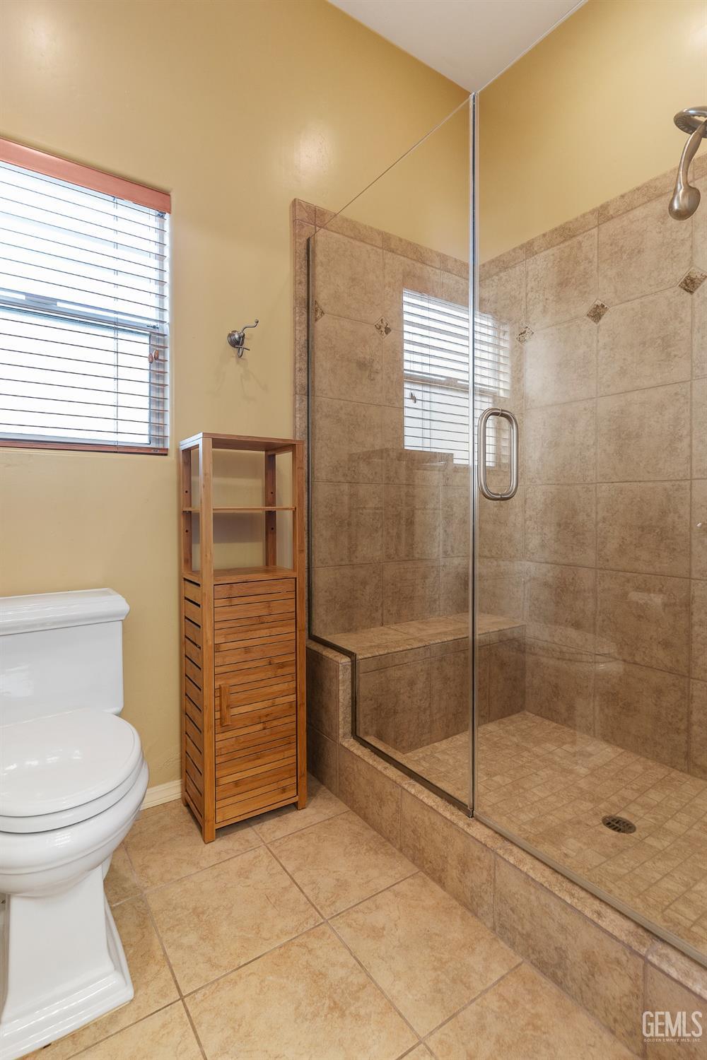 Undisclosed Address Bakersfield, CA 93306 - Photo 24 of 41 a bathroom with a toilet and a shower