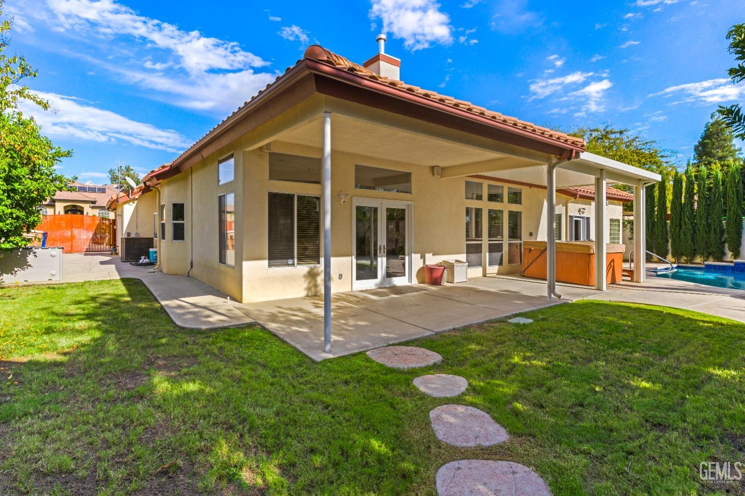 Undisclosed Address Bakersfield, CA 93306 - Photo 28 of 41 a front view of a house with a yard