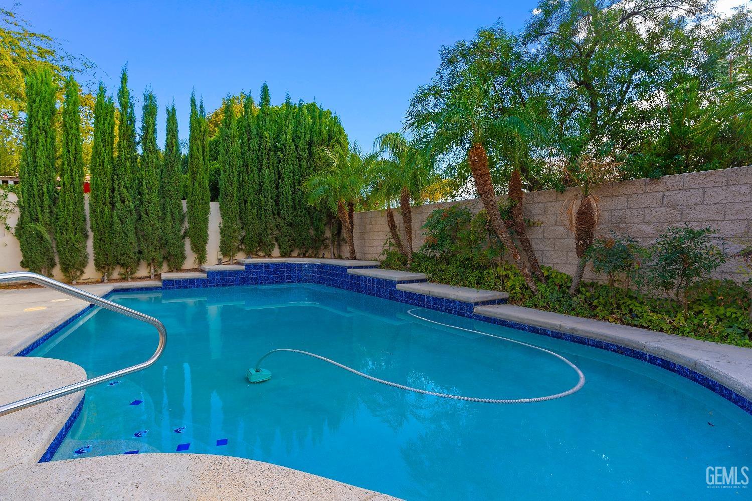 Undisclosed Address Bakersfield, CA 93306 - Photo 30 of 41 a view of a swimming pool with a patio