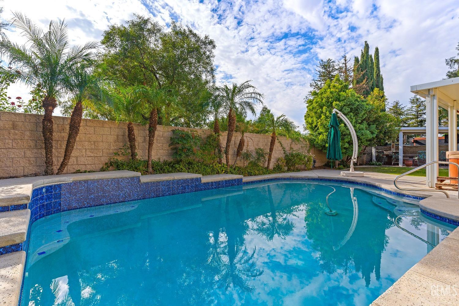 Undisclosed Address Bakersfield, CA 93306 - Photo 31 of 41 a view of a backyard with swimming pool