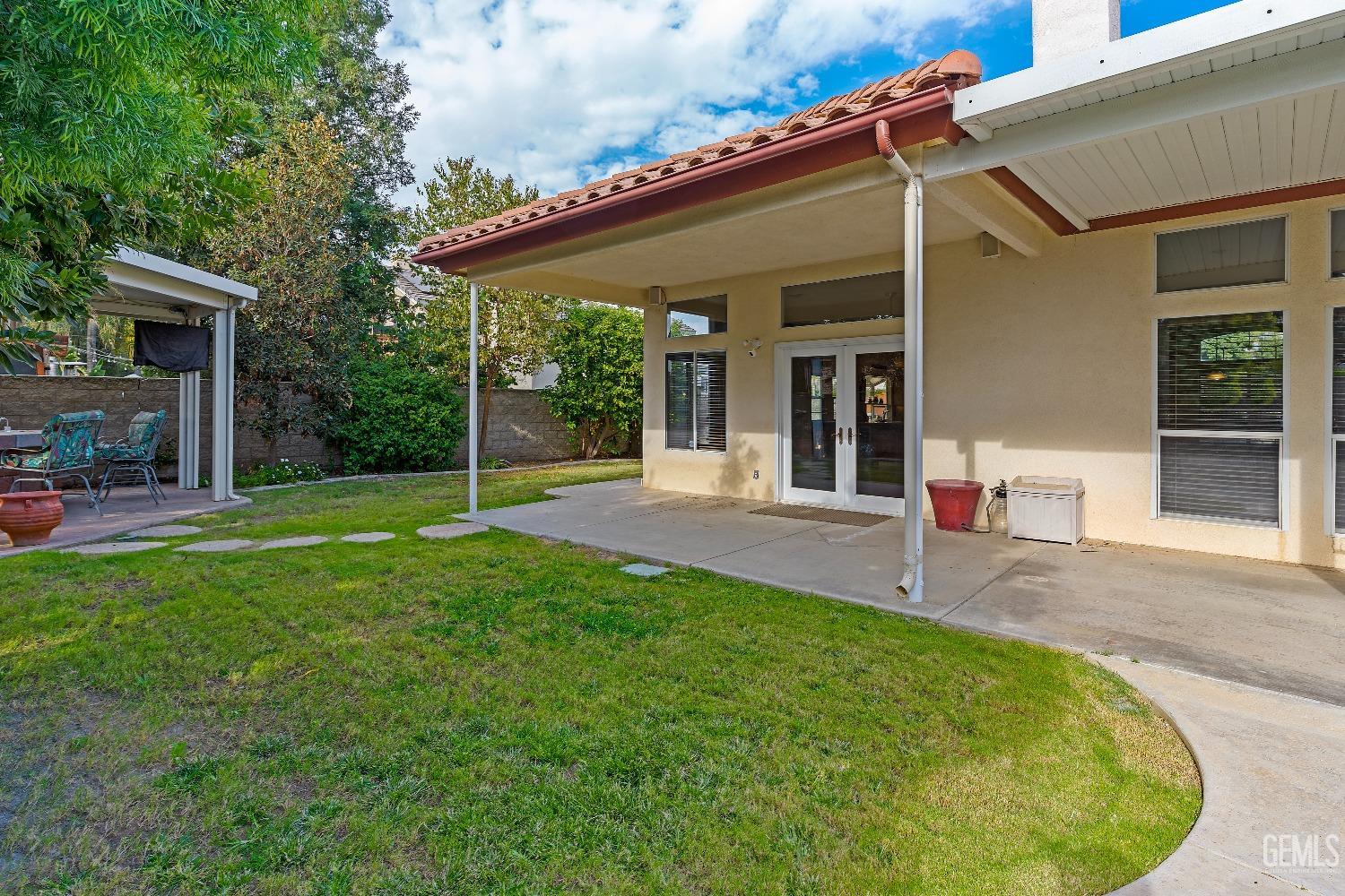 Undisclosed Address Bakersfield, CA 93306 - Photo 32 of 41 front view of a house with a yard