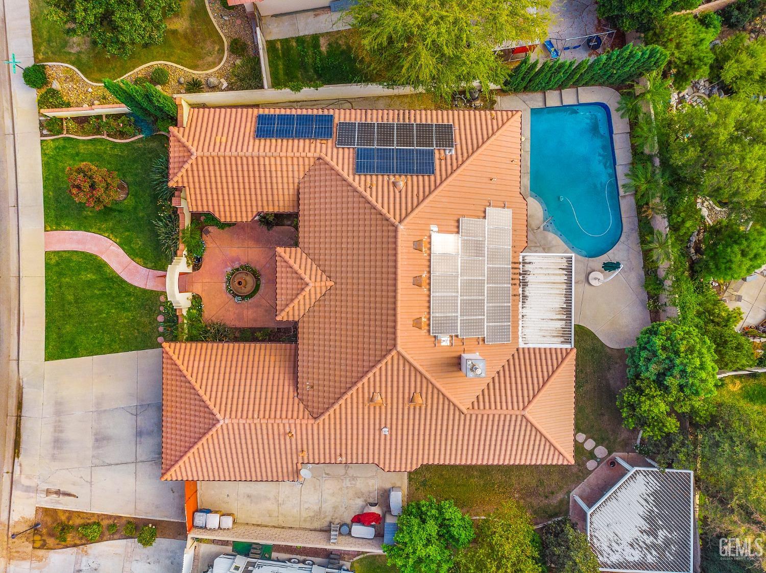 Undisclosed Address Bakersfield, CA 93306 - Photo 39 of 41 an aerial view of a house with garden space and street view