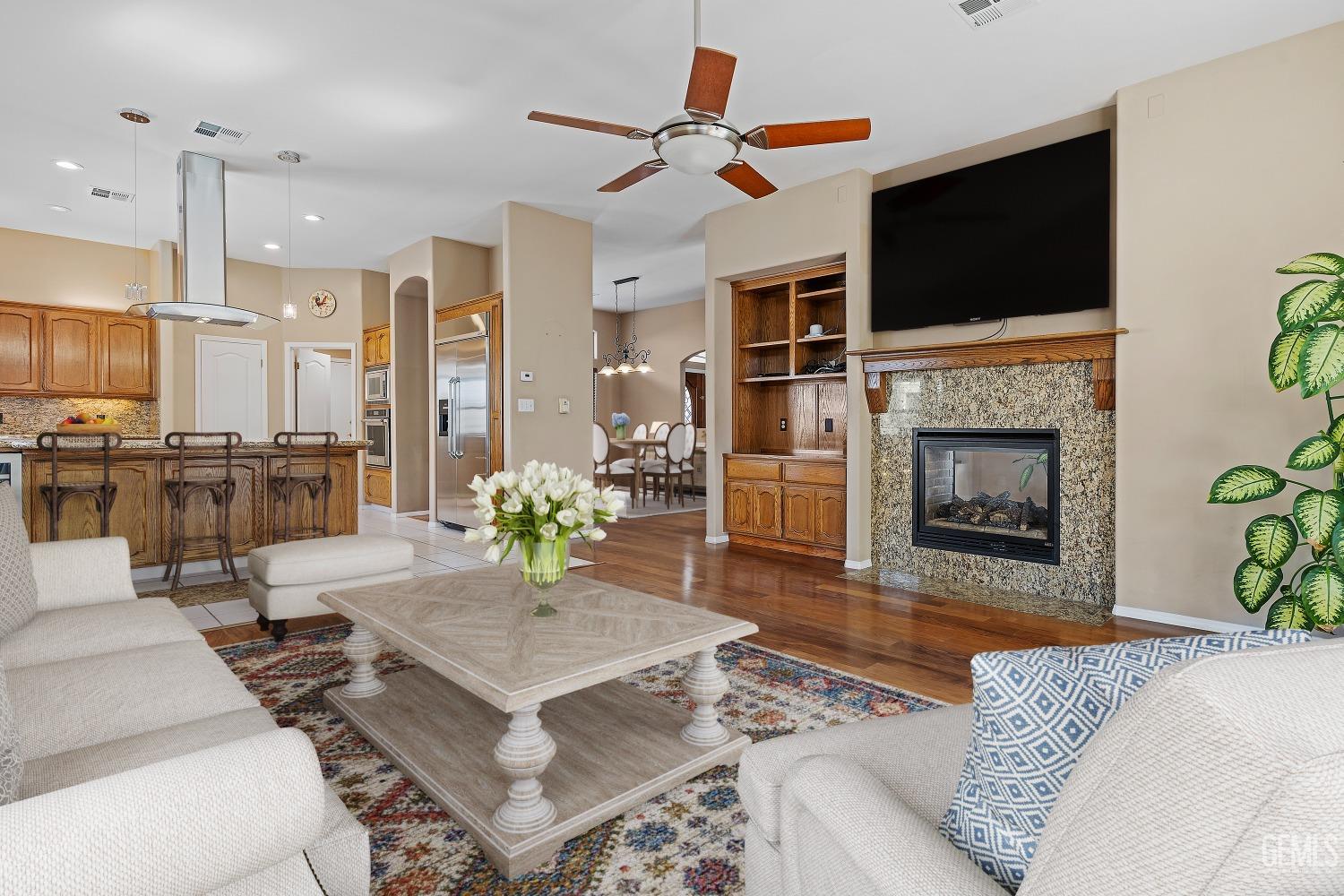 Undisclosed Address Bakersfield, CA 93306 - Photo 4 of 41 a living room with furniture and a fireplace