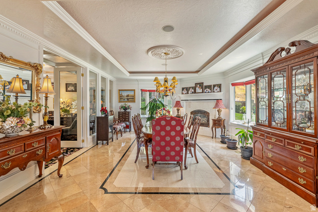 4093 North Imperial Way Provo, UT 84604 - Photo 17 of 96 Formal dining area featuring extensive crown molding and an elegant tray ceiling with a medallion detail