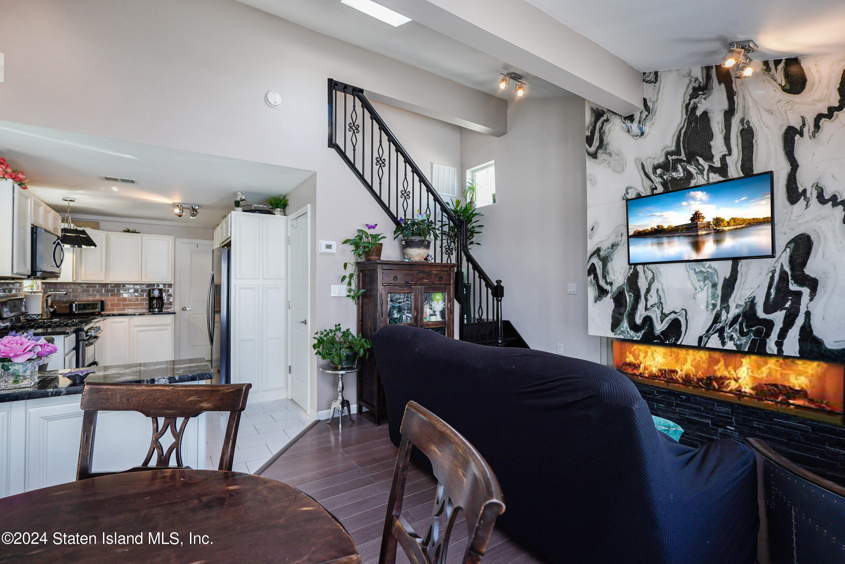 38 Milbank Road Staten Island, NY 10306 - Photo 12 of 30 a living room with furniture and a flat screen tv